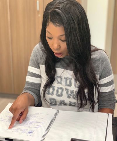 Brooke Richardson works on reading and speech at an inpatient rehabilitation facility following a stroke.