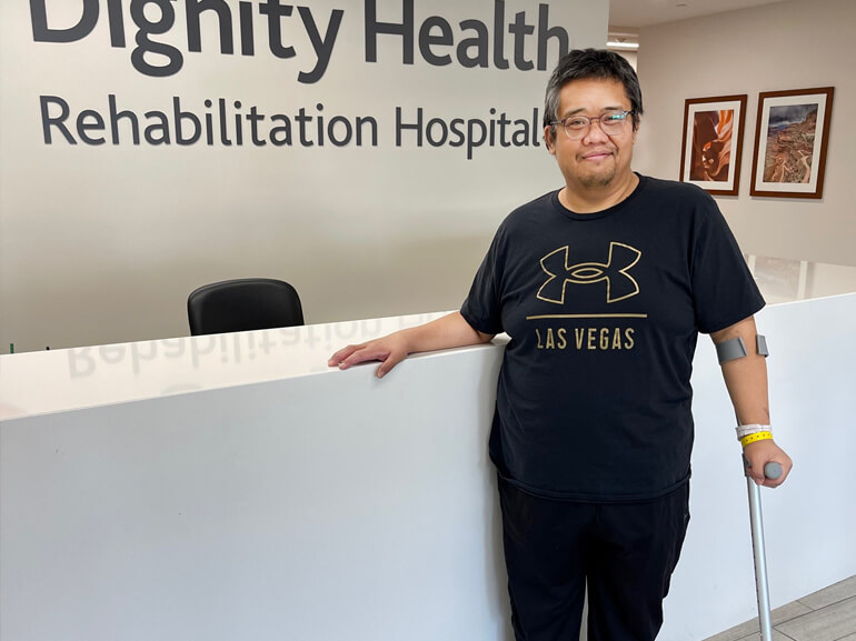 Jarell Geaga stands in the front lobby.