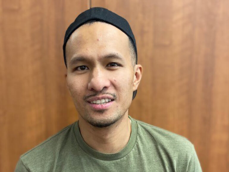 Nick Espiritu smiles after completing therapy.