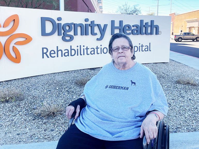 Patricia Randall sits in her wheelchair outside Dignity Health Rehabilitation Hospital.